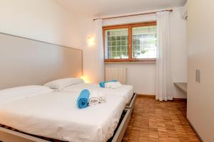 Posteľ alebo postele v izbe v ubytovaní Casa Raffaella -Ciao Vacanze- + 33 fotografií