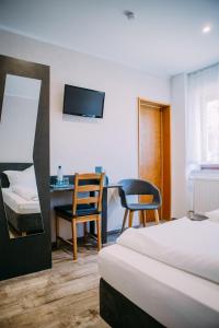 Postel nebo postele na pokoji v ubytování Hotel Restaurant Nöth