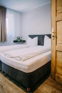 Postel nebo postele na pokoji v ubytování Hotel Restaurant Nöth
