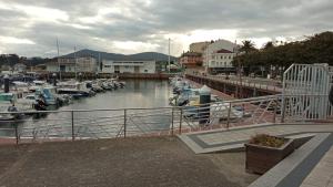 a group of boats docked in a marina at O Recuncho de Celia in Foz