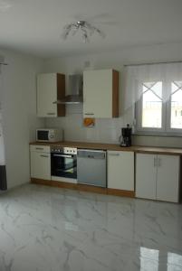 Kuchyň nebo kuchyňský kout v ubytování Apartment Seline 9 nur 200 m bis zum Strand