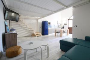 a living room with a couch and a table at Loft 92 in San Vito lo Capo