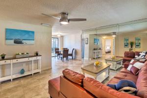 a living room with a couch and a table at Bright Venice Home with Yard Less Than 4 Miles to Beach! in Venice