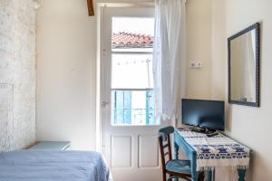Postel nebo postele na pokoji v ubytování Yiayia's guesthouse