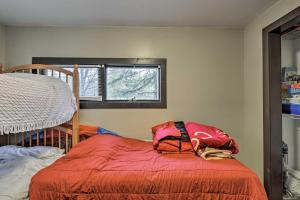 Un pat sau paturi într-o cameră la Gaylord Home with Fire Pit - 3 Mi to Otsego Lake!