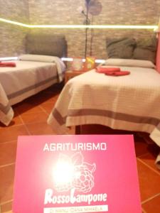 Postel nebo postele na pokoji v ubytování Agriturismo Rosso Lampone