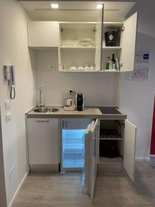 Kuchyňa alebo kuchynka v ubytovaní A&F Apartment Padova centro storico