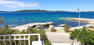 a view of a body of water with a dock at Luxury Beach Villa, Sibenik in Šibenik