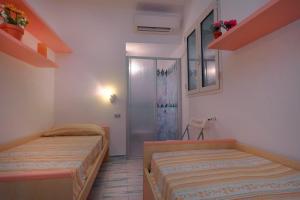 A bed or beds in a room at Sea View - Rena Bianca