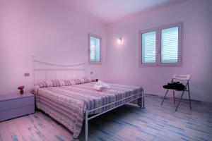 A bed or beds in a room at Sea View - Rena Bianca