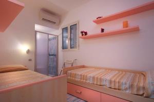 A bed or beds in a room at Sea View - Rena Bianca