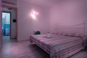 A bed or beds in a room at Sea View - Rena Bianca