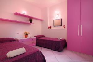 A bed or beds in a room at Sea View - Rena Bianca