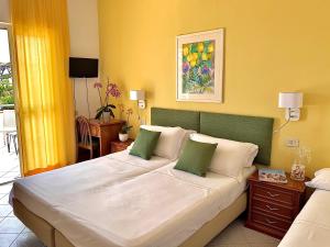Postel nebo postele na pokoji v ubytování Resort Villa Flavio