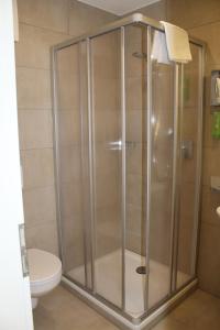 Koupelna v ubytování Garni Hotel Schmaus