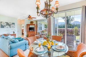 a living room with a table with bananas on it at Plantations at Princeville #512 in Princeville