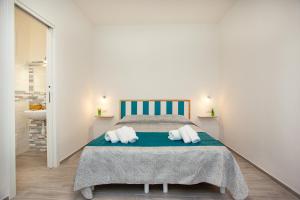Postel nebo postele na pokoji v ubytování Camere Tirreno 1