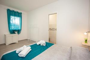 Postel nebo postele na pokoji v ubytování Camere Tirreno 1