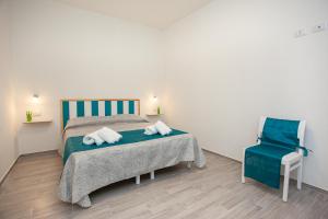 Postel nebo postele na pokoji v ubytování Camere Tirreno 1