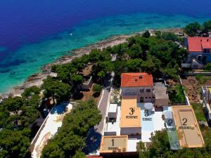 an aerial view of a house next to the ocean at Beach Residences Caroline in Hvar