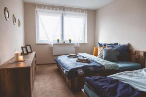 A bed or beds in a room at Apartmán Zara