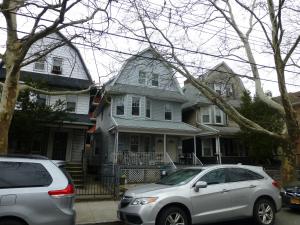 two cars parked in front of a house at Classical American House 4 in Brooklyn