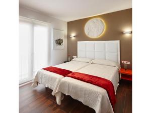 Postel nebo postele na pokoji v ubytování Apartamentos Caballerizas con parking gratuito