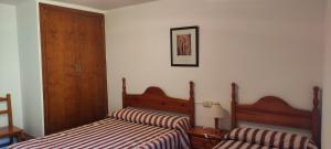A bed or beds in a room at Apartamento Miguel Torla Ordesa