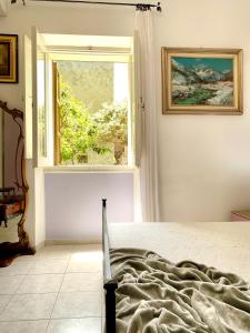 Ένα ή περισσότερα κρεβάτια σε δωμάτιο στο Villa Rocco Rooms