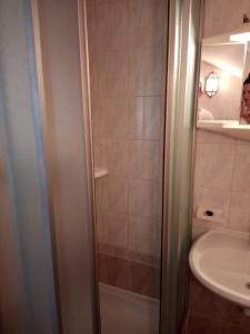 a bathroom with a shower and a sink at Apartmani Ivana in Novalja +27 photos