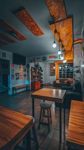 a living room with a table and a couch at Social Hostel Café e Bar in Curitiba