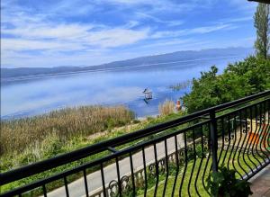 a view of a lake with a boat in the water at Villa Stefan in Ohrid