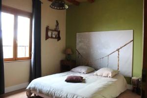 Ein Bett oder Betten in einem Zimmer der Unterkunft Le Patio de Rieucourt