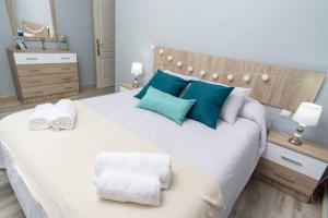 מיטה או מיטות בחדר ב-Pablo Neruda Tourist Home