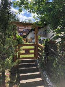 a staircase leading to a house with a wooden fence at Ferienwohnung Könnecke Bad Harzburg in Bad Harzburg