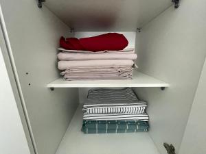 a closet with white towels on a shelf at Castle Residence apt. Zamorei in Buşteni +42 photos