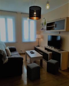 TV a/nebo společenská místnost v ubytování Vivienda turística Ramón Trillo en Muxía