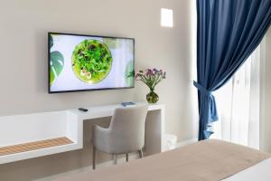 A television and/or entertainment centre at Alma Suites