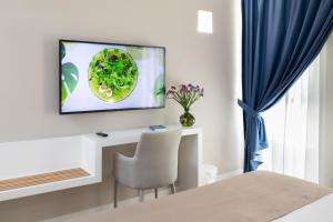 TV a/nebo společenská místnost v ubytování Alma Suites
