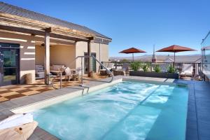 a swimming pool on the roof of a house at The Advenire, Autograph Collection in St. George