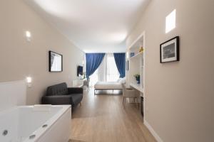 A bed or beds in a room at Alma Suites
