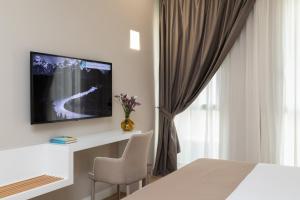 A television and/or entertainment centre at Alma Suites