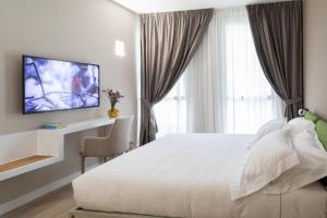 A television and/or entertainment centre at Alma Suites