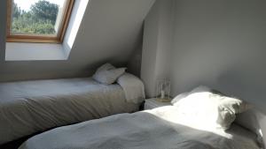 Posteľ alebo postele v izbe v ubytovaní Apartamentos Descubre Rías Baixas