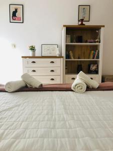 Posteľ alebo postele v izbe v ubytovaní Virág Apartman