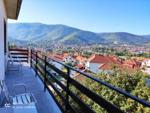 a balcony with a view of the mountains at Soko-Veljkovic-apartman in Soko Banja
