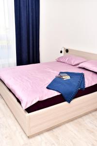Posteľ alebo postele v izbe v ubytovaní VIP Apartament 11