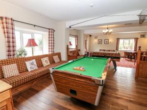 a living room with a pool table in it at Poacher's Arms in Hope