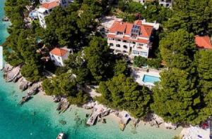 an aerial view of a house on a island in the water at Villa Ima in Brela
