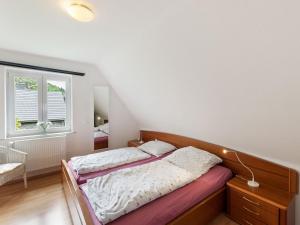 a bedroom with a bed and a window at Beautiful Holiday Home in Winterberg near Ski Slopes in Winterberg